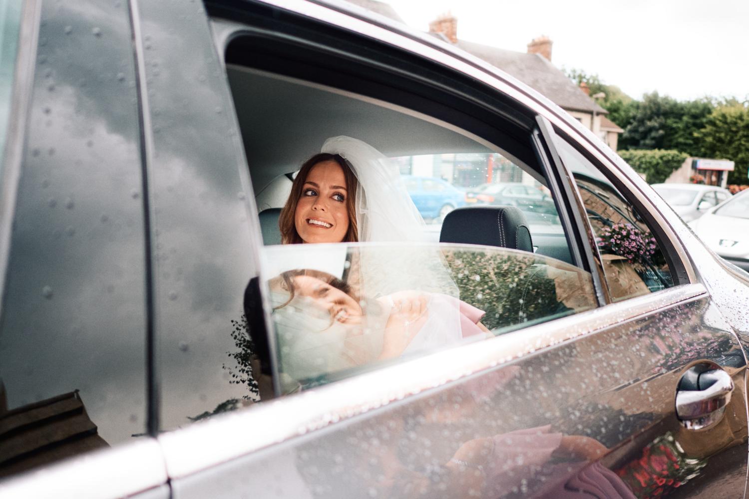 A bride arrives in a car at Dungannon Catholic Church