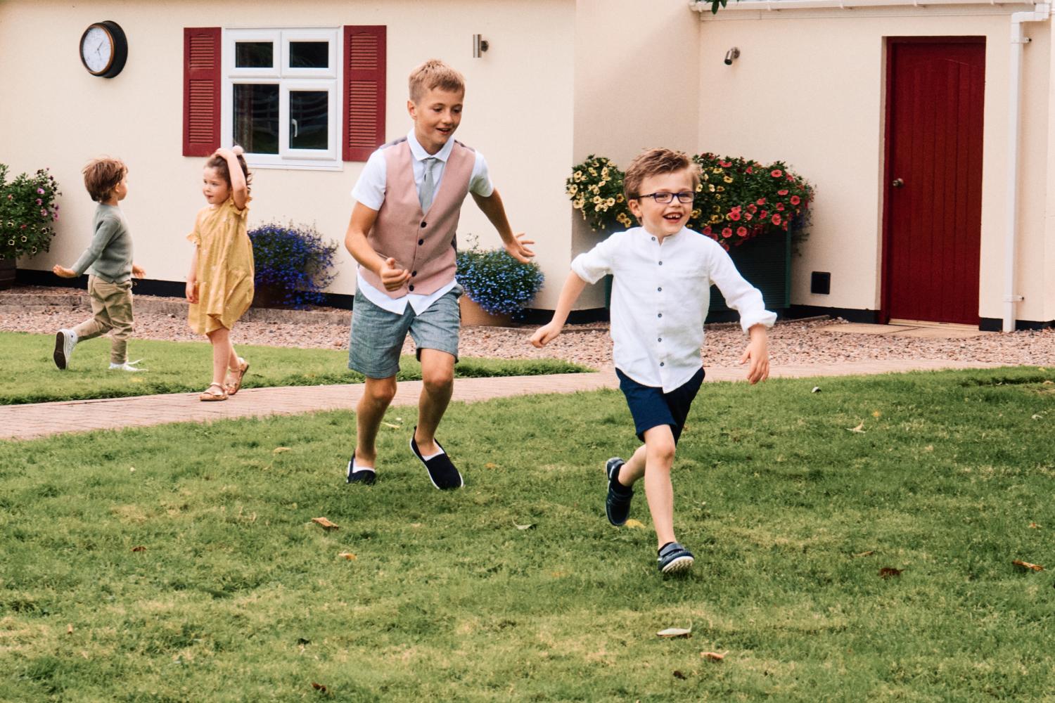 Children play at a wedding garden reception