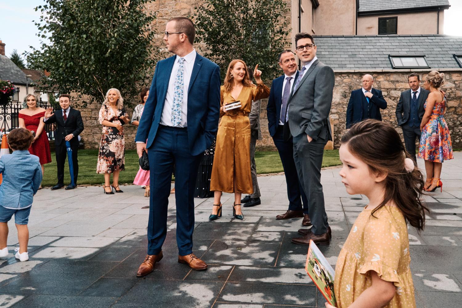 Wedding guests congregate outside a chapel in Dungannon