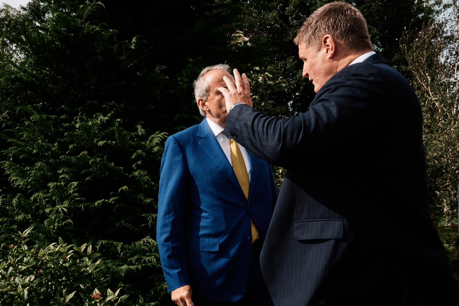 Two men talk outside a chapel in Ireland