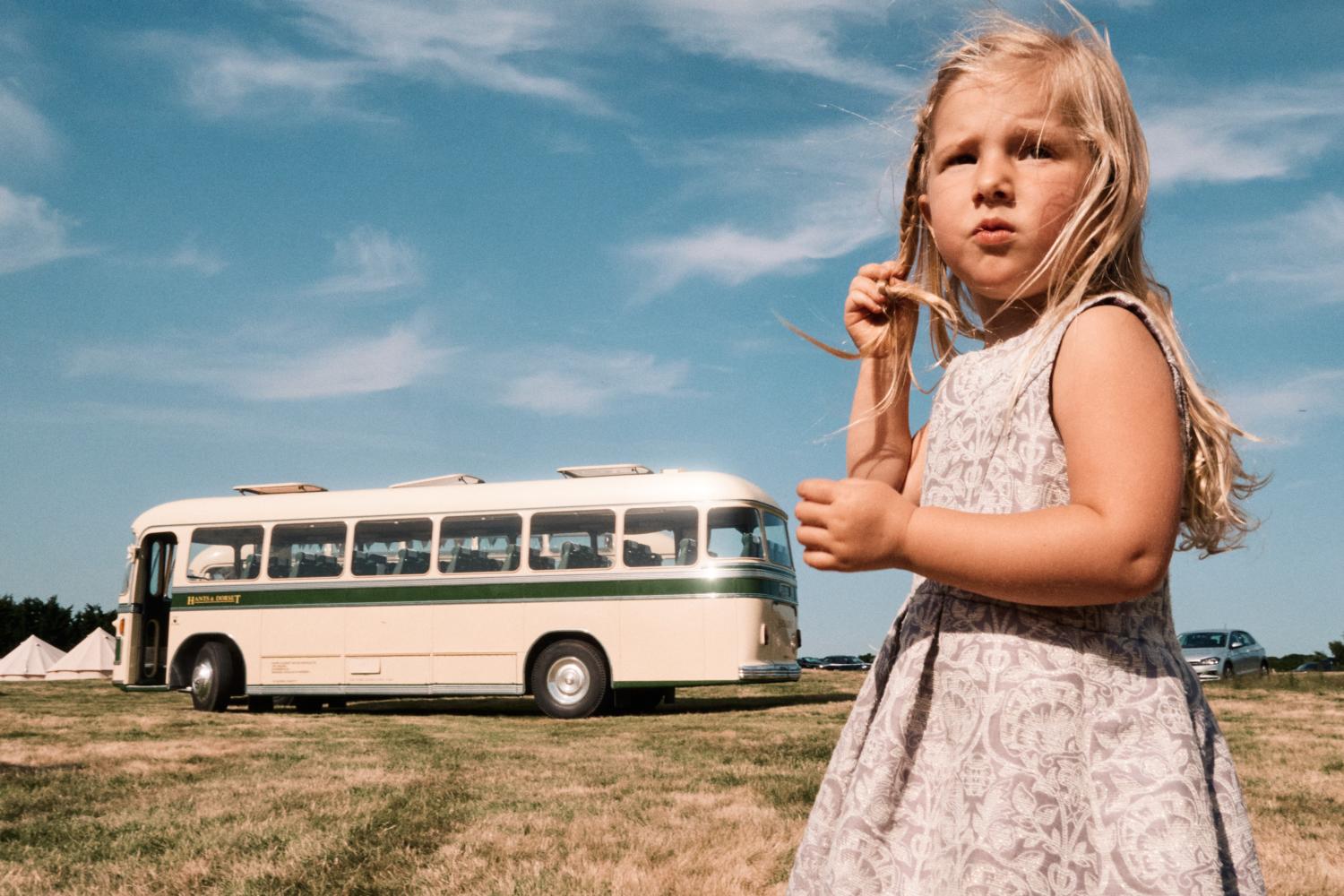 Child in front of a bus