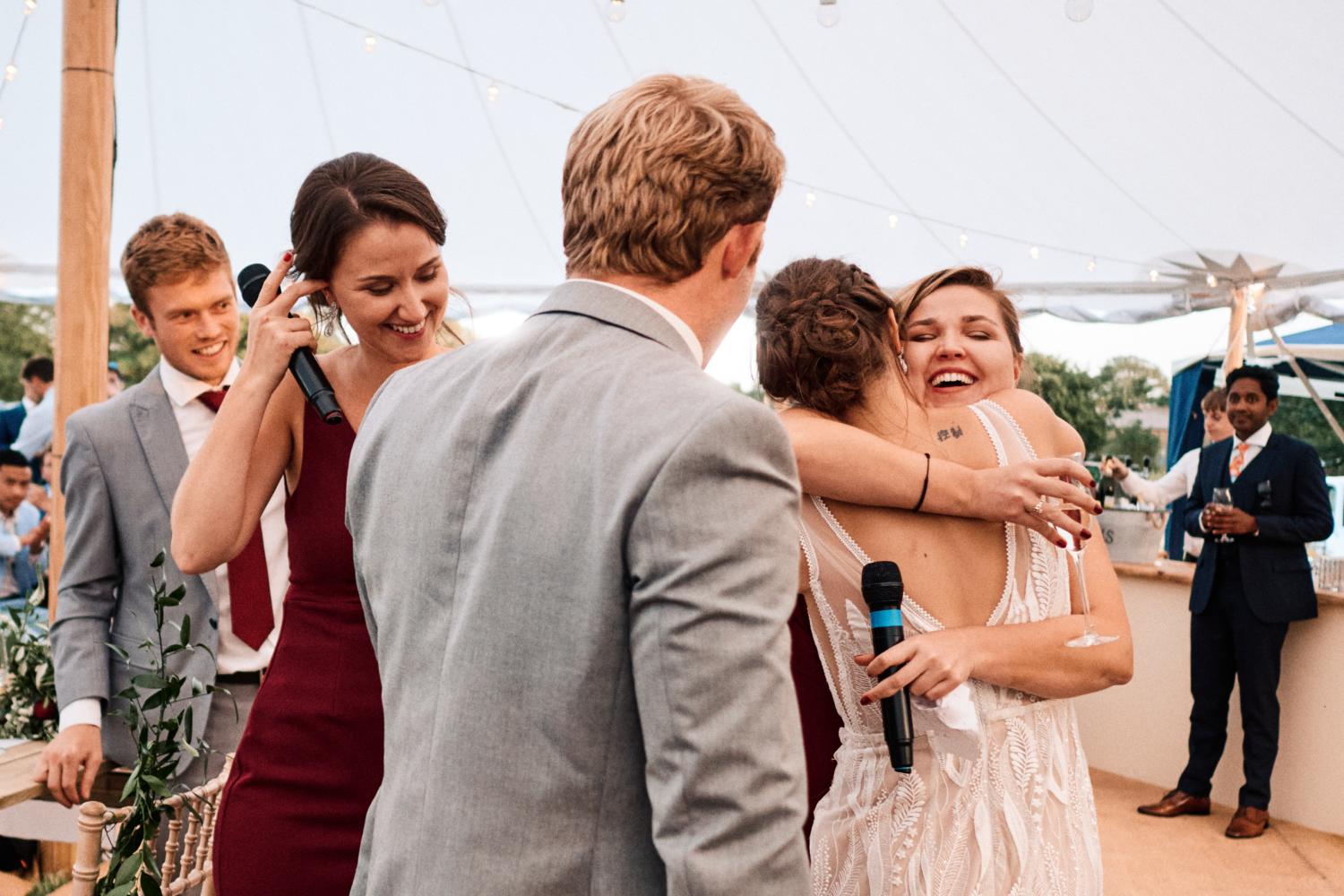 Bride hugs sister after speeches